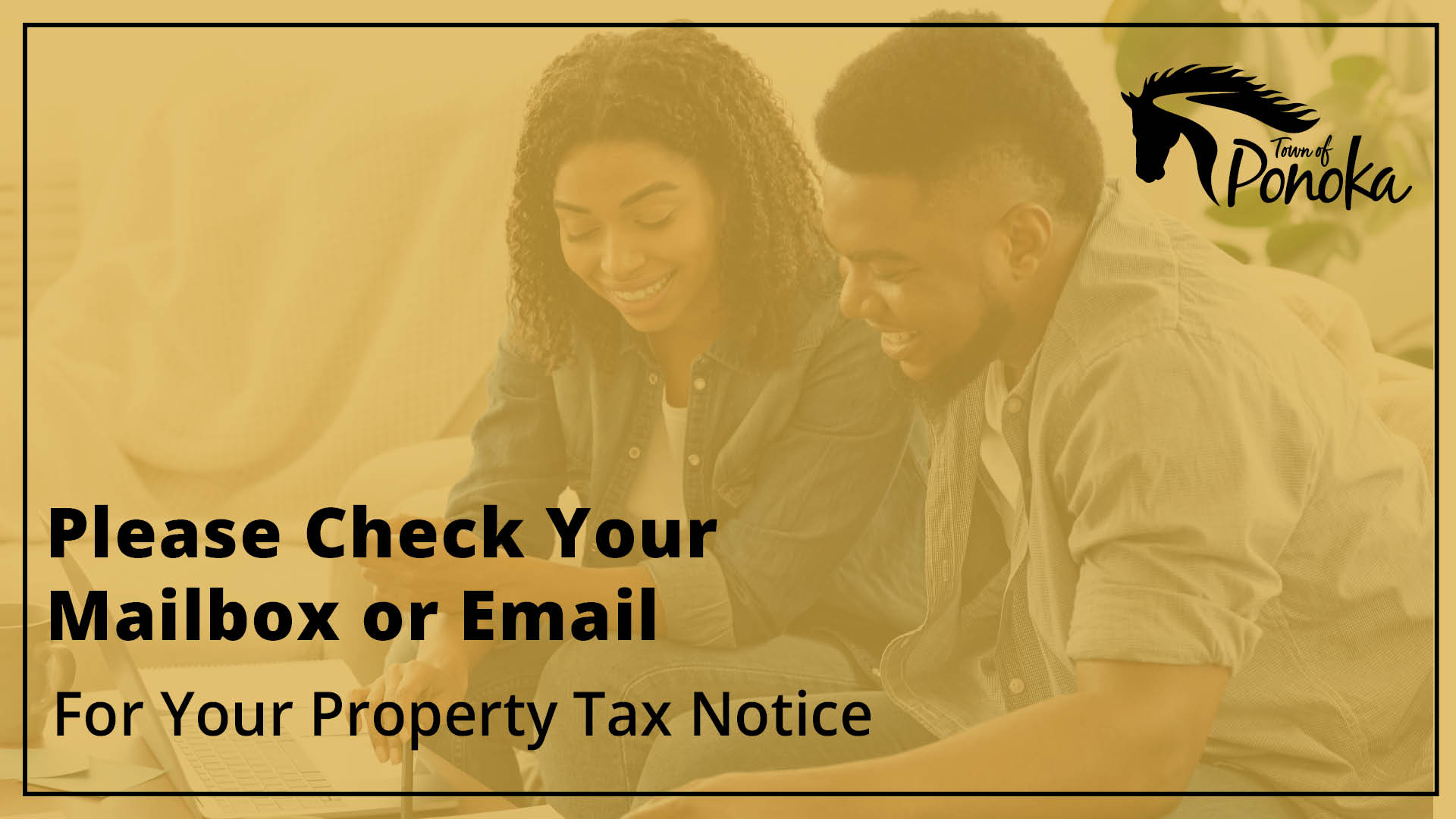 A young couple going through paperwork in their living room