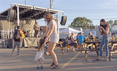 Family dancing in front of the stage to music