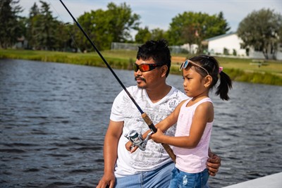 Daughter and father fishing